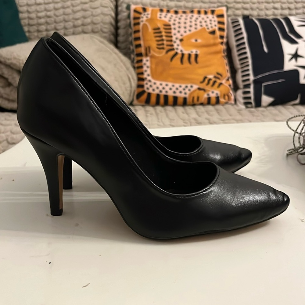 Lightly used black burju pumps. Only worn 4-5 times. Super comfortable.